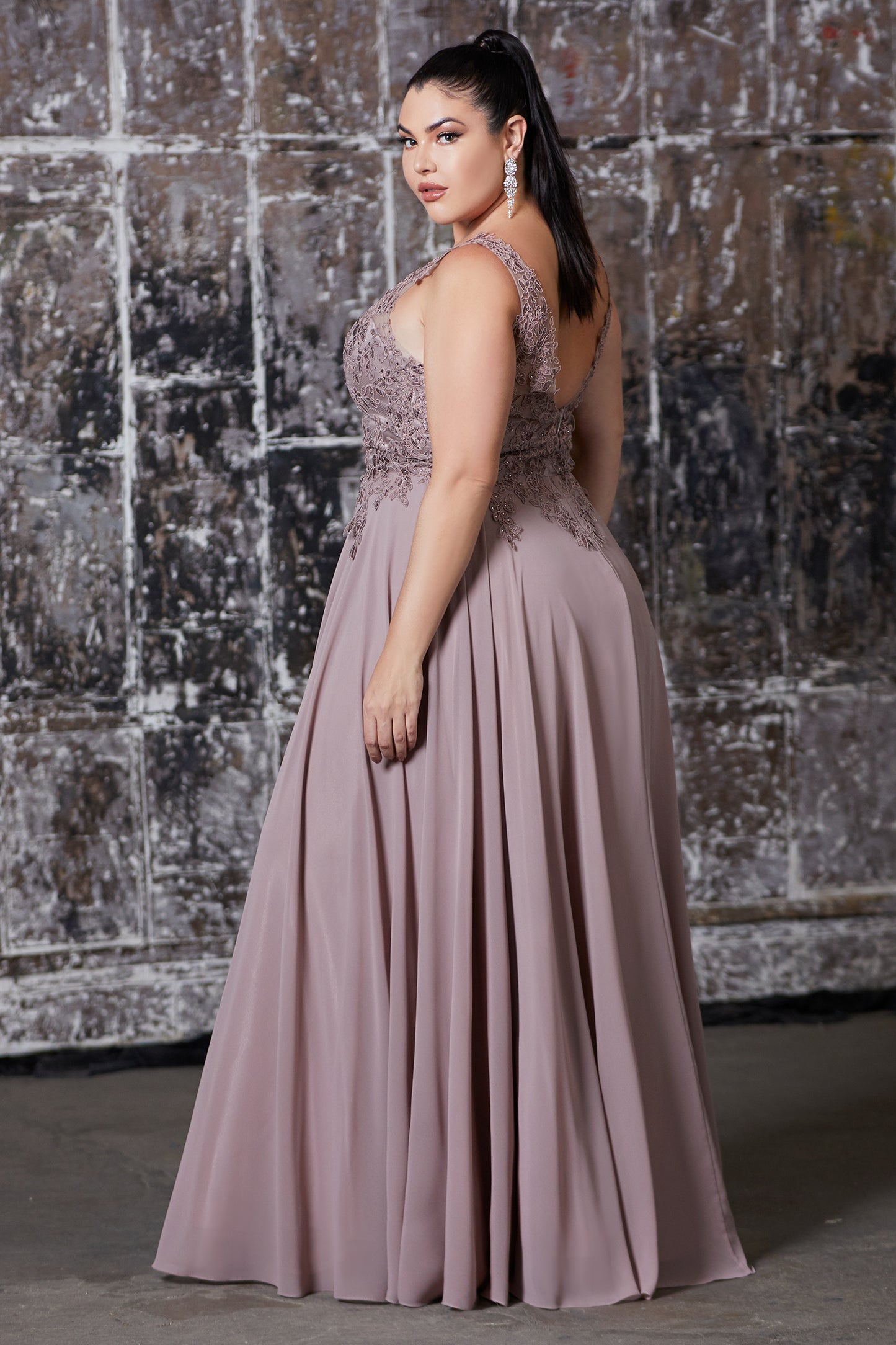 Curve Collection A-line chiffon gown with lace applique bodice and v-neckline.